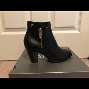 NEVER WORN HIGH HEELED BOOTIES